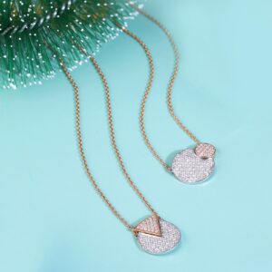 Sophisticated diamond pendants displayed on a vibrant aqua background, perfect for jewelry highlights.